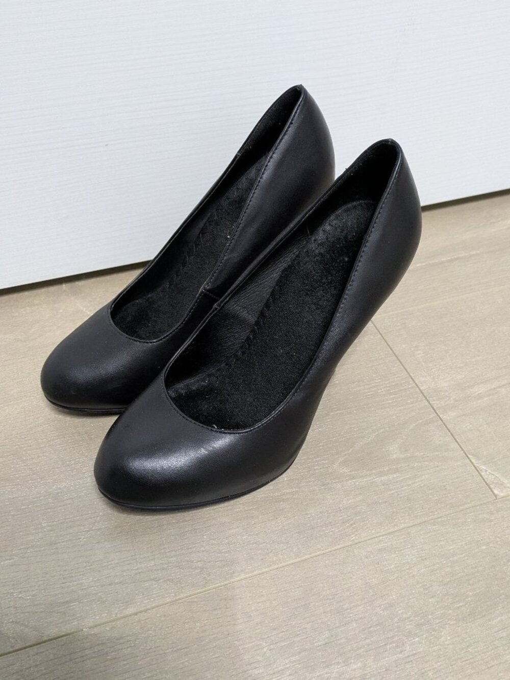 Worn out black 5" heels